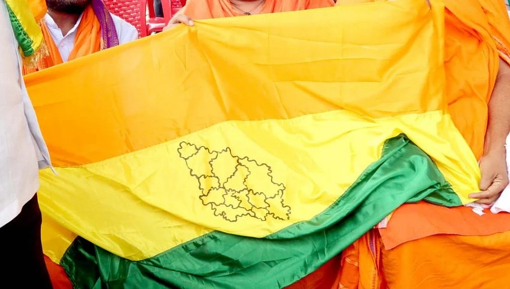 Protesters holding a North Karnataka flag. 