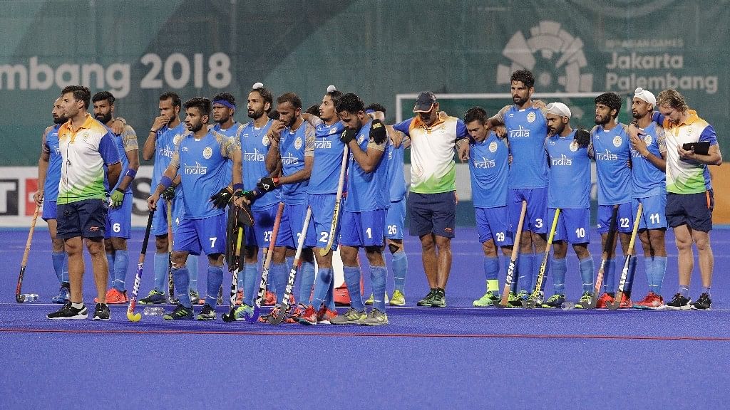 India’s team wait during the penalty shootout at their men’s hockey semi-final match against Malaysia.