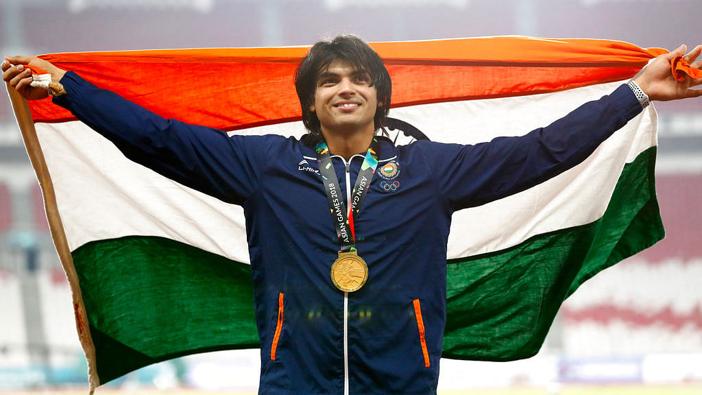 Javelin thrower Neeraj Chopra poses with his Asian Games gold medal.