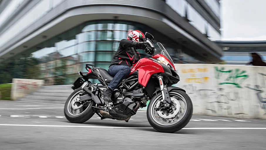 The bike has a 937cc liquid cooled Testastretta engine that makes about 112bhp of power and 96Nm of torque.