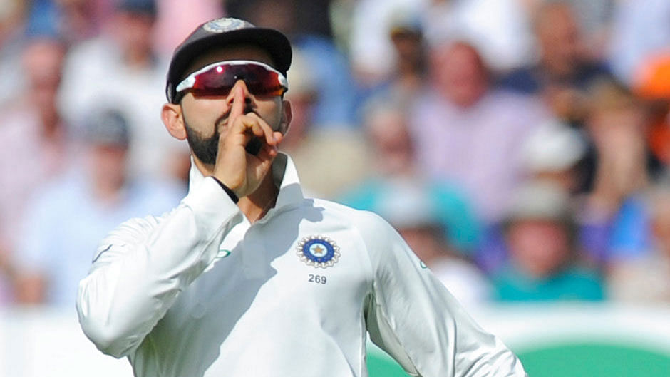 Virat Kohli celebrates the dismissal of England’s captain Joe Root on Day 1 of the first Test.