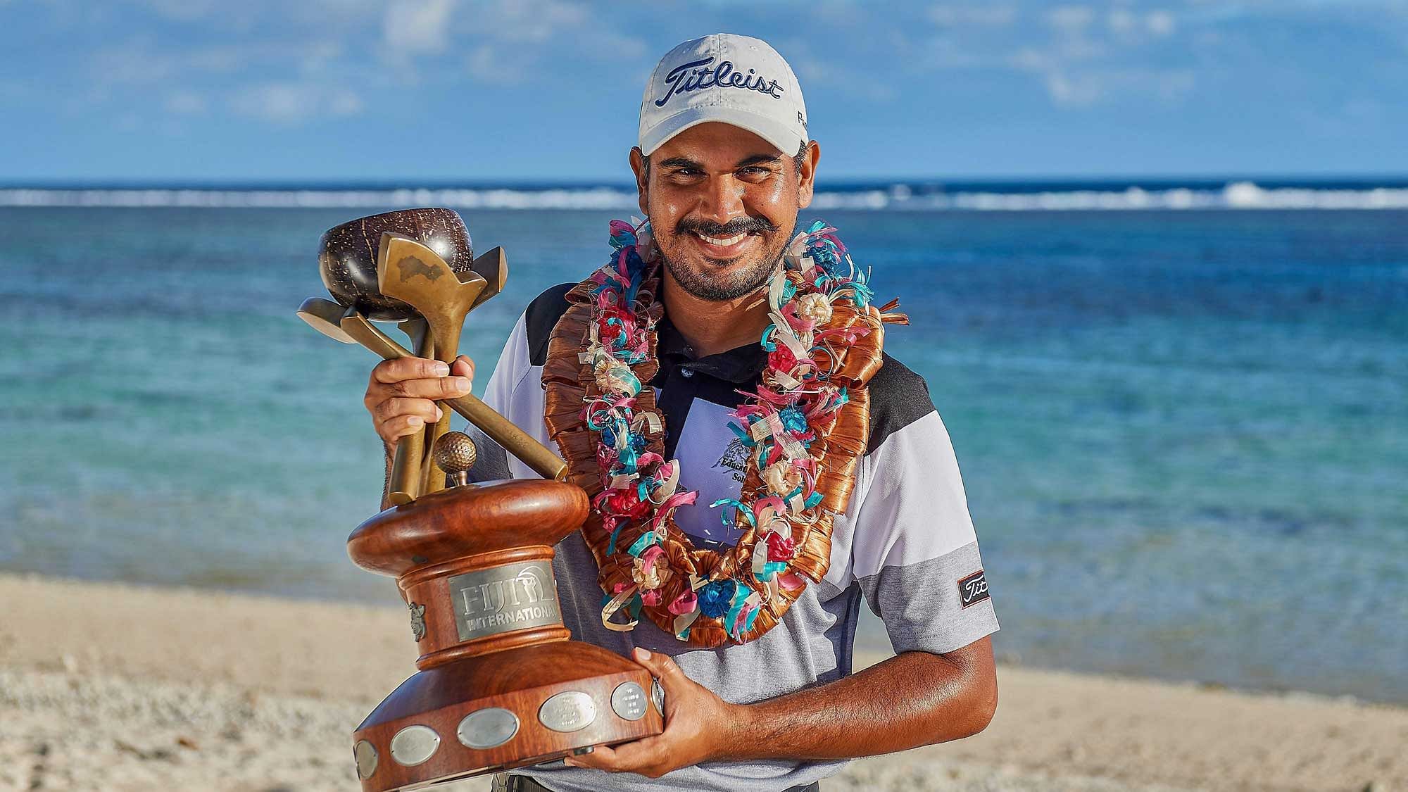 Indian golfer Gaganjeet Bhullar poses with the trophy after winning his maiden European Tour title with a brilliant chip-in eagle on the 17th hole for a one-stroke win over Australia’s  Anthony Quayle during the Fiji International Golf at The Intercontinental Gold Club in Fiji on Sunday.