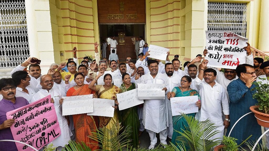  RJD, Congress and Communist Party of India legislators stage a protest against the Muzaffarpur shelter home rape case, during the ongoing Monsoon Session, outside Bihar Assembly in Patna on 26 July.&nbsp;