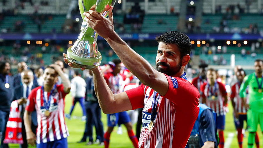  Diego Costa lifts up the UEFA Super Cup.