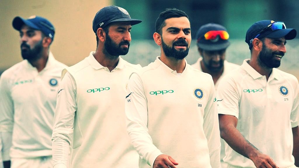 Virat Kohli leads his teammates off the field during a Test match.
