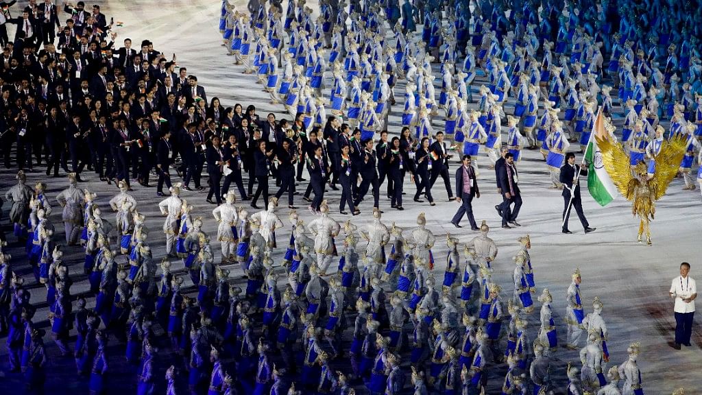 The 572 member Indian contingent arrives at the opening ceremony of the 18th Asian Games 2018.