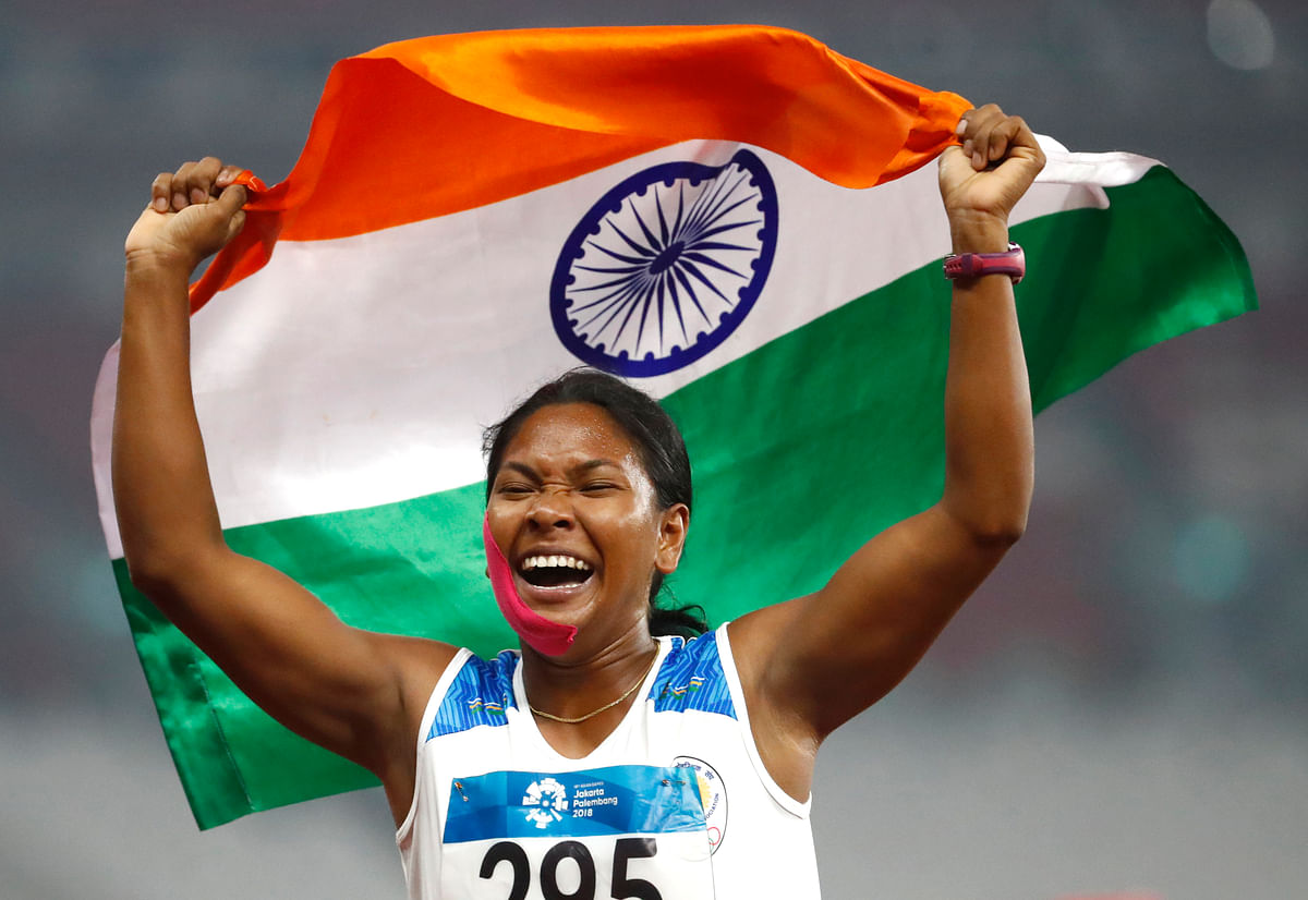 India’s Swapna Barman celebrates after winning the heptathlon gold medal during the athletics competition at the 18th Asian Games in Jakarta, Indonesia.