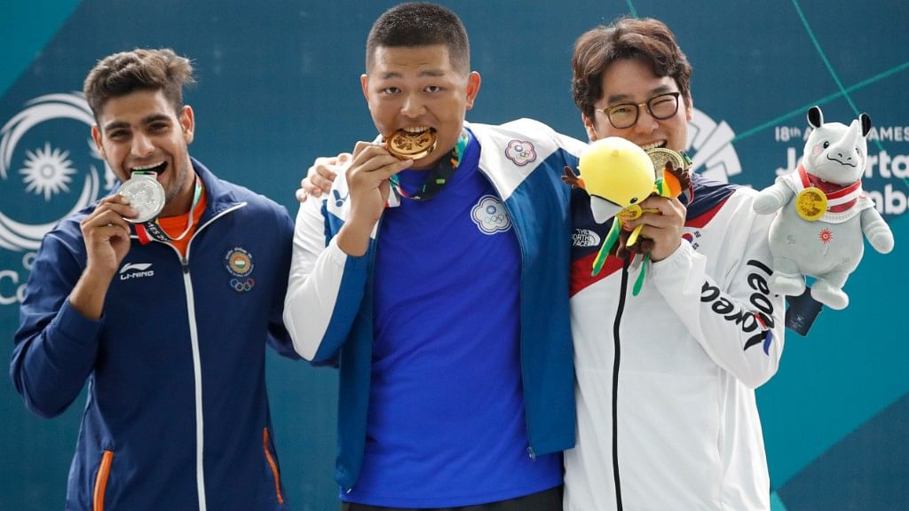 From left: Silver medalist India’s Lakshay, gold medalist Taiwan’s Yang Kunpi and bronze medalist South Korea’s Ahn Daemyeong at the awards ceremony of the Men’s trap shooting event at the 18th Asian Games on Monday.