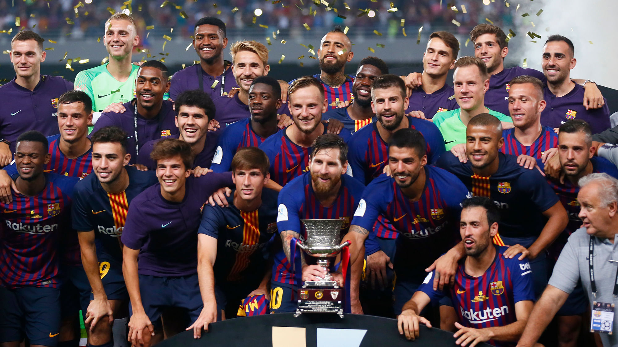 Barcelona players pose with the trophy after winning the Spanish Super Cup soccer match between Sevilla and Barcelona in Tangier, Morocco, Sunday, Aug. 12, 2018. Barcelona won 2-1.&nbsp;