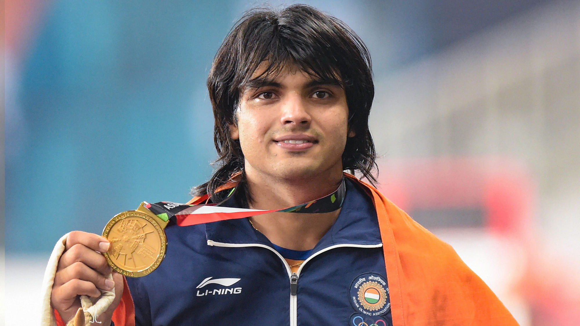 Jakarta: Gold medallist India’s Neeraj Chopra poses for photographs at the medal ceremony of the men’s javelin throw event during the 18th Asian Games 2018 in Jakarta, Indonesia.