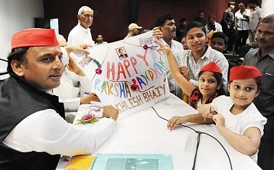 Lucknow: Samajwadi Party President Akhilesh Yadav celebrates Raksha Bandhan with children, in Lucknow on Aug 26, 2018. (Photo: IANS)