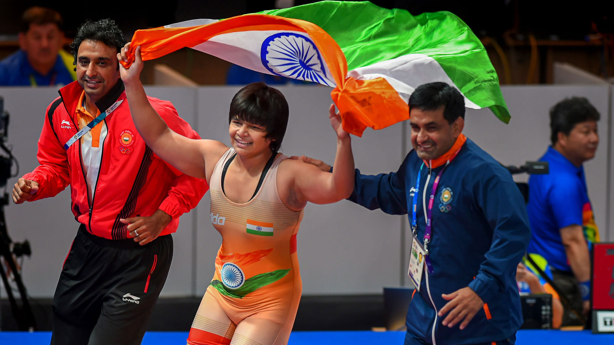 Wrestler Divya Kakran celebrates after winning a bronze medal at the Asian Games.