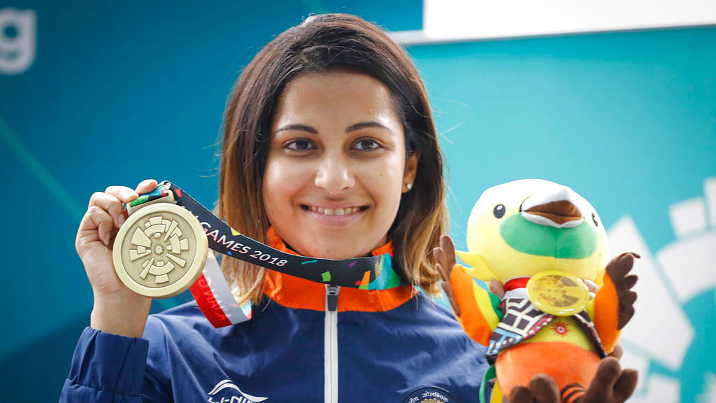 India’s Heena Sidhu poses with her bronze medal at the Asian Games.