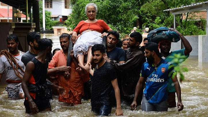 A woman being rescued during floods that ravaged the state of Kerala in August.