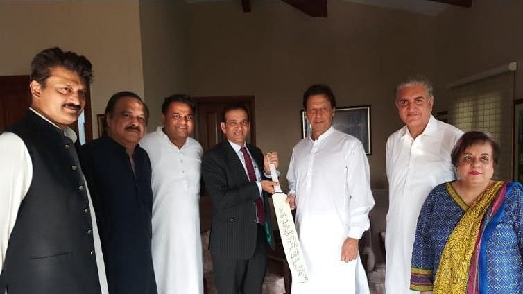 The cricket bat gifted to Imran Khan was signed by the entire Indian cricket team.