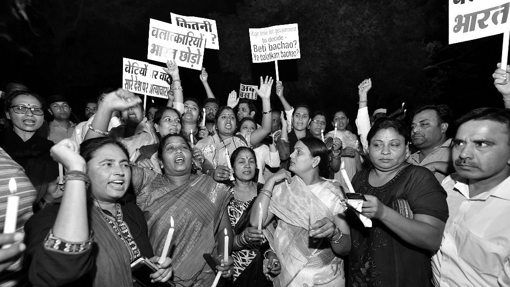 Protesters during a midnight candlelight vigil against the Unnao rape case.