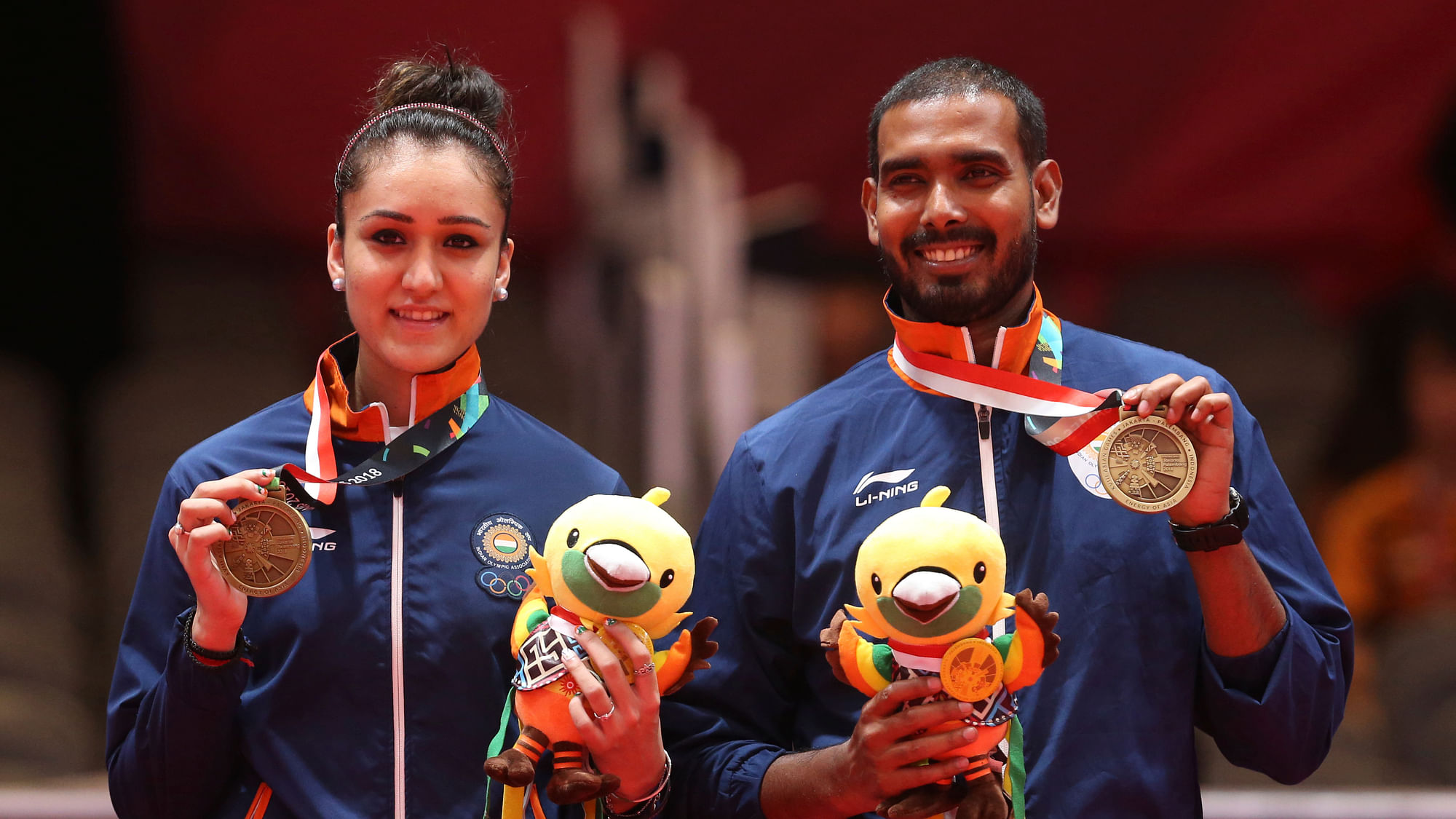 Manika Batra (L) and Sharat Kamal (R) after clinching bronze in their mixed doubles will look to advance in their individual events.