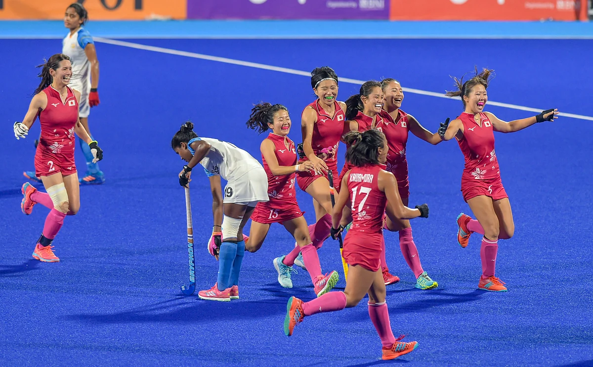 The Japanese team celebrate after winning the final against India.