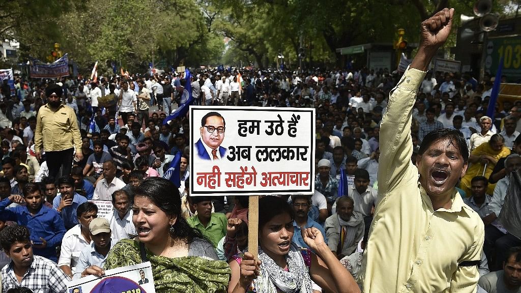 Members of the Dalit community raise slogans during Bharat Bandh against the alleged dilution of SC/ST Act in New Delhi, on 2 April 2018.