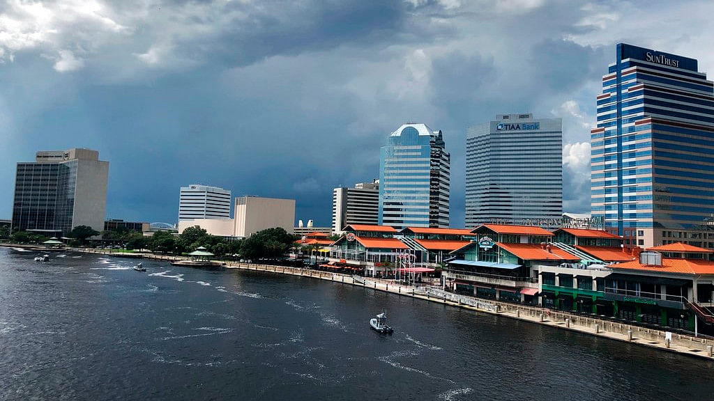 The Coast Guard and local law enforcement patrol the St. John’s River outside Jacksonville Landing as seen from a view from Main Street Bridge in Jacksonville on Sunday, 26 August 2018.