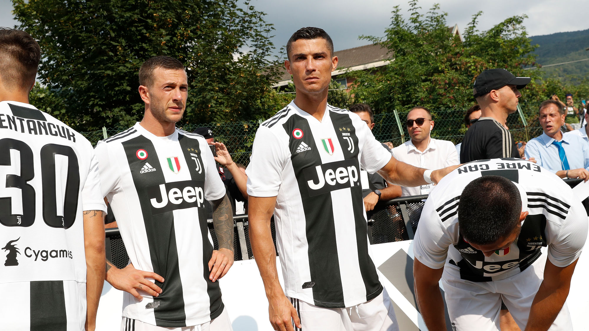 From left, Juventus’ Federico Bernardeshi, Rodrigo Bentancur, Cristiano Ronaldo and Emre Can arrive to take part in a friendly match between the Juventus A and B teams, in Villar Perosa, northern Italy, Sunday, Aug.12, 2018.