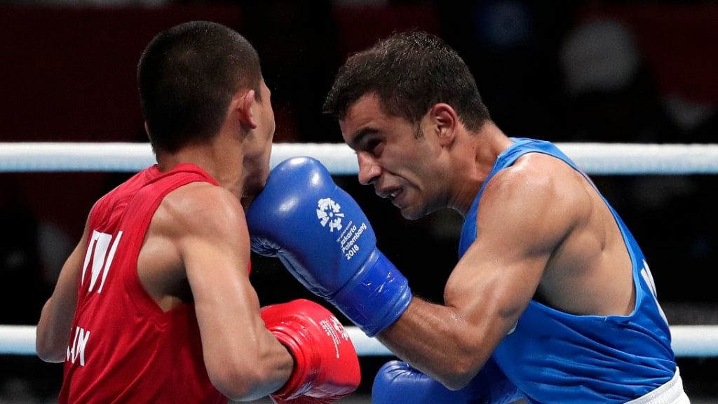India’s Amit Panghal (in blue) in action against Philippines’ Carlo Paalam.
