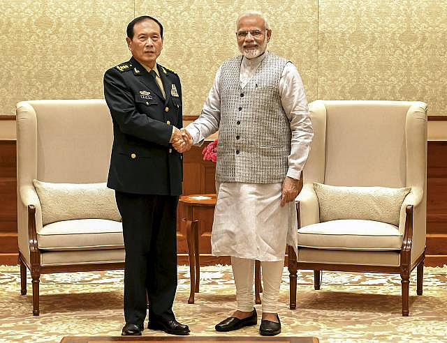 Prime Minister Narendra Modi with the Defence Minister of China, General Wei Fenghe during a meeting in New Delhi on 21 August, 2018.