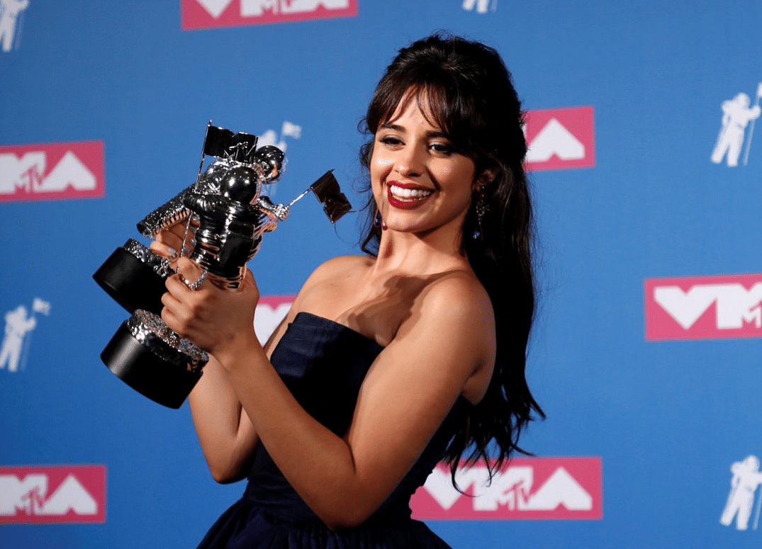 Camila Cabello with her Moon Man trophies.