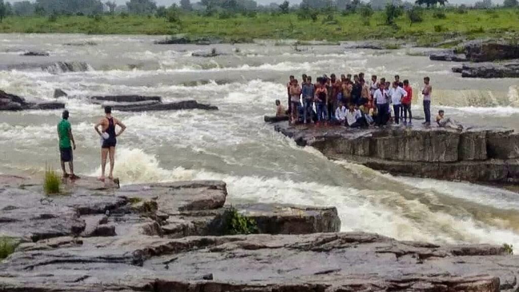 Rescue operations underway as tourists get stranded at a picnic spot in Sultan Garh Waterfalls after water level increased due to sudden release from a dam, in Shivpuri on Wednesday, Aug 15, 2018.