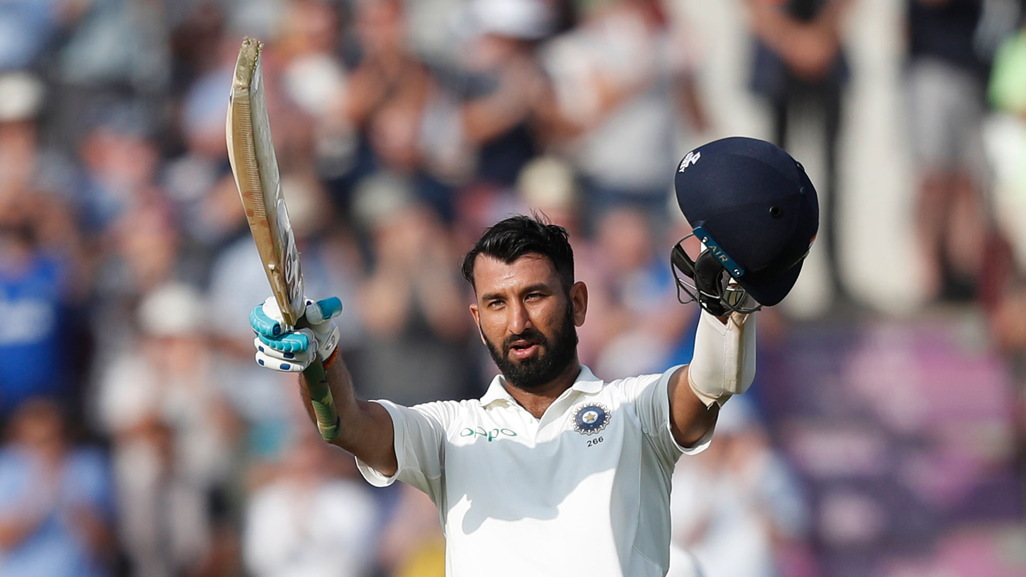 Cheteshwar Pujara celebrates getting 100 runs not out during play on the second day of the 4th cricket test match between England and India on Friday, 31 August.