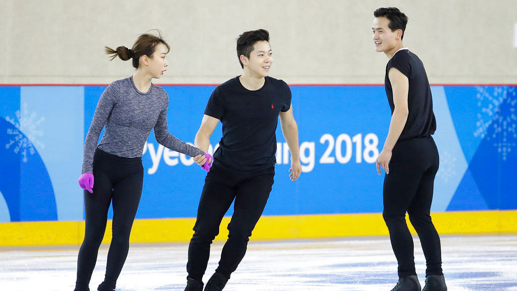 North Korea’s Kim Ju Sik, right, skates next to South Korea’s Kim Kyueun, left, and Kam Alex Kang Chan during a Pairs Figure Skating training session prior to the 2018 Winter Olympics in Gangneung, South Korea.&nbsp;