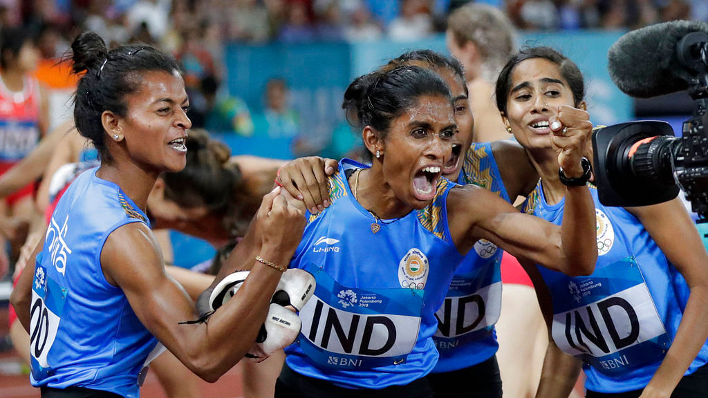 India’s 4x400m relay team celebrate after winning a gold medal during the athletics competition at the 18th Asian Games.