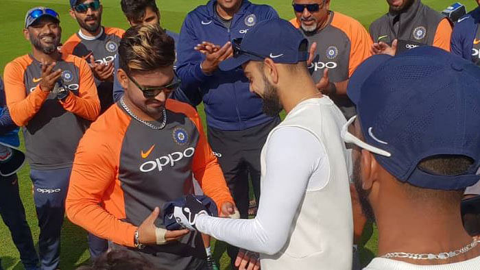 Virat Kohli hands over the India Test cap to Rishabh Pant ahead of the third Test against England.