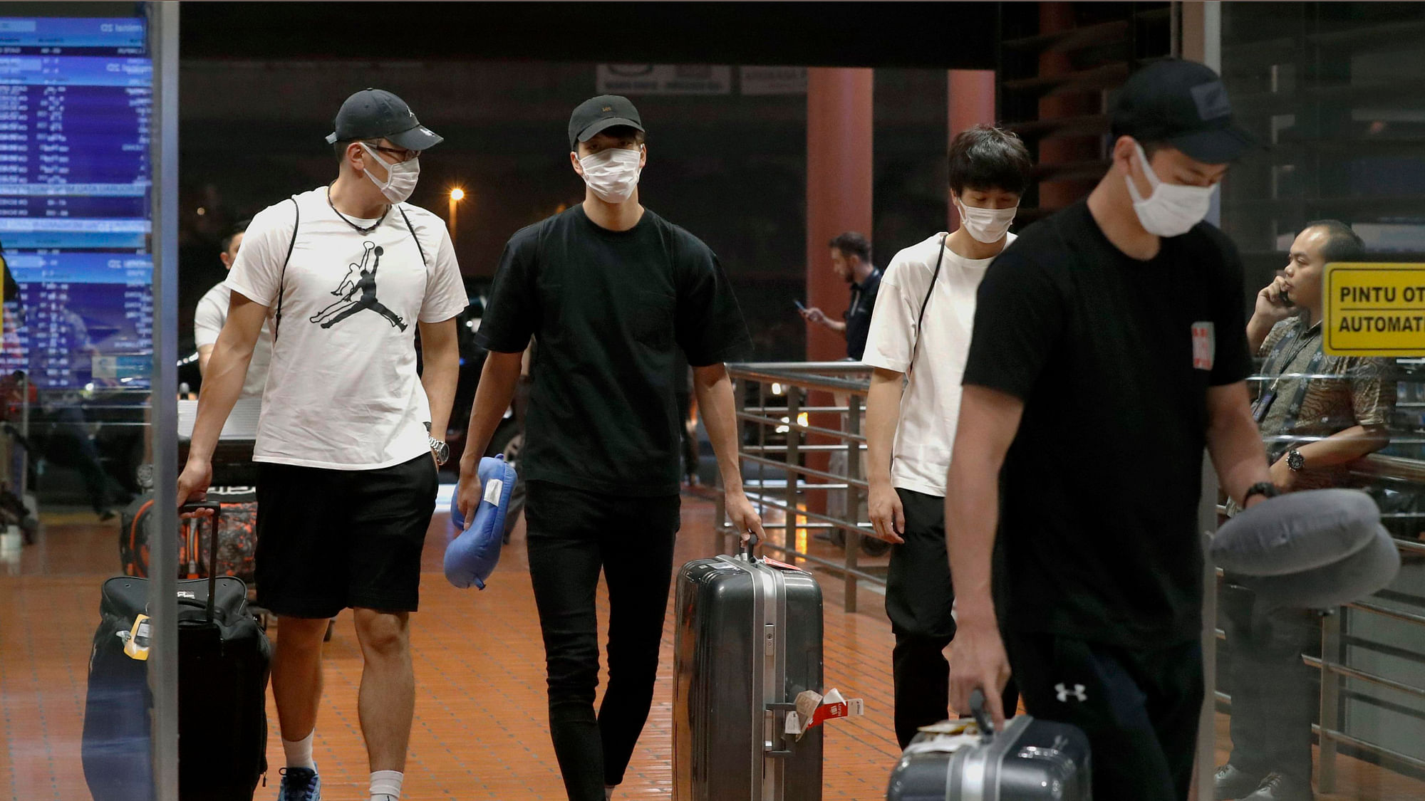 Four Japanese basketball players arrive at Jakarta airport Monday, Aug. 20, 2018. They were kicked off their Asian Games team and sent home Monday after they “spent the night in a hotel with women.”&nbsp;
