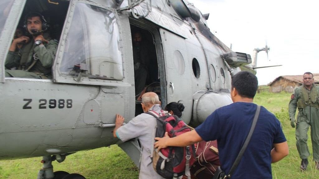 People being rescued from an island in Arunachal Pradesh by the Indian Air Force.  