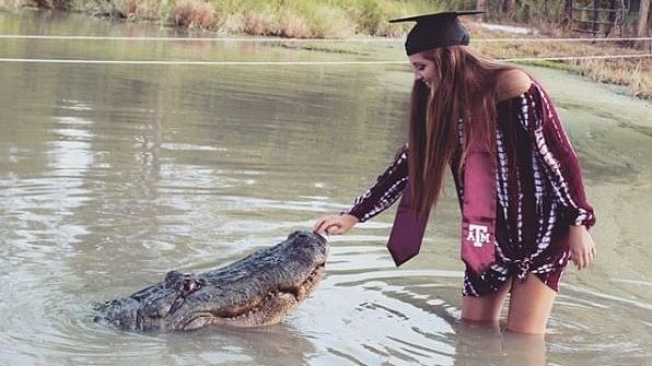 Texas student celebrates her graduation with friendly alligator.