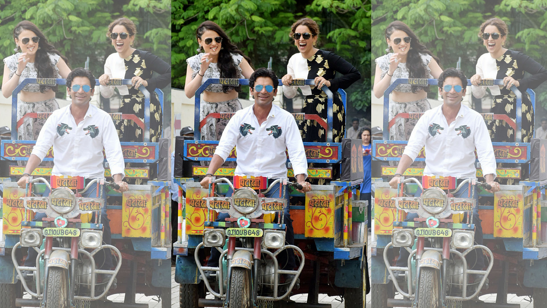 Sunil Grover with Radhika Madan and Sanya Malhotra ride into a multiplex in Mumbai.