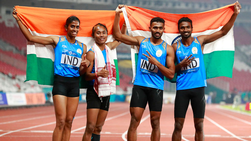 India’s 4x400m mixed relay team celebrate after winning a silver medal at the Asian Games.
