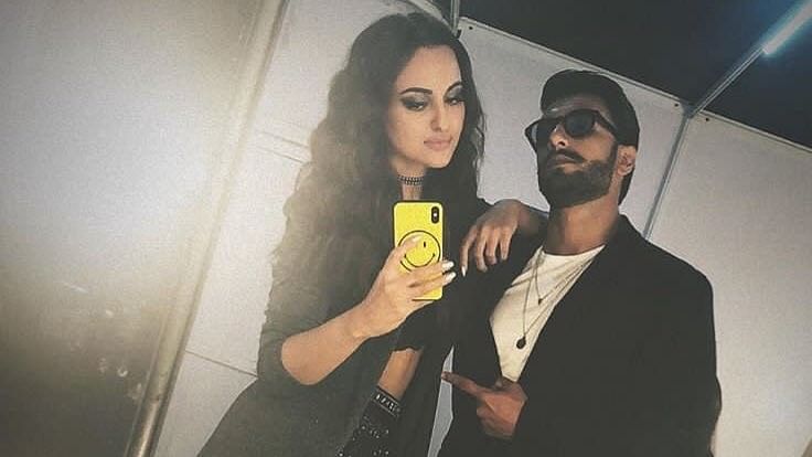 Sonakshi Sinha and Ranveer Singh take out a moment during the fashion event.&nbsp;
