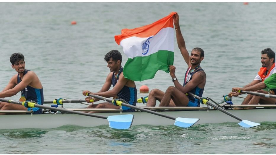 Indian rowing Mens team members Sawarn Singh, Bhokanal Dattu, Om Prakash and S Singh Quadruple Sculls with national flag celebrate after the medal ceremony winning the gold medal during the 18th Asian Games Jakarta Palembang 2018, in Indonesia on Friday.
