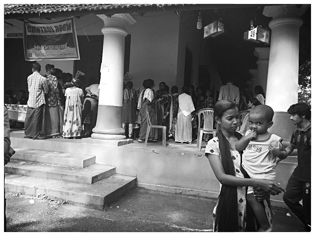 Sunita and Amaya at the camp where flood victims have queued up to register themselves.