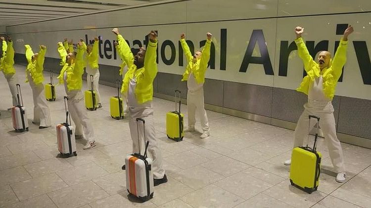 Staff at Heathrow airport perform a tribute to Freddie Mercury.