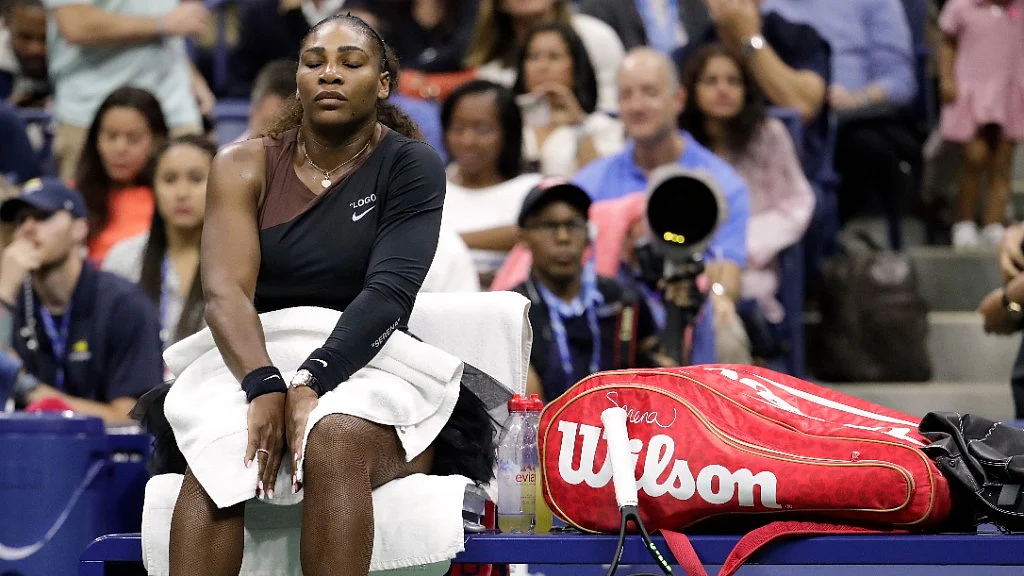 Serena Williams takes a break during a changeover against Naomi Osaka during the women’s final of the US Open on Saturday.