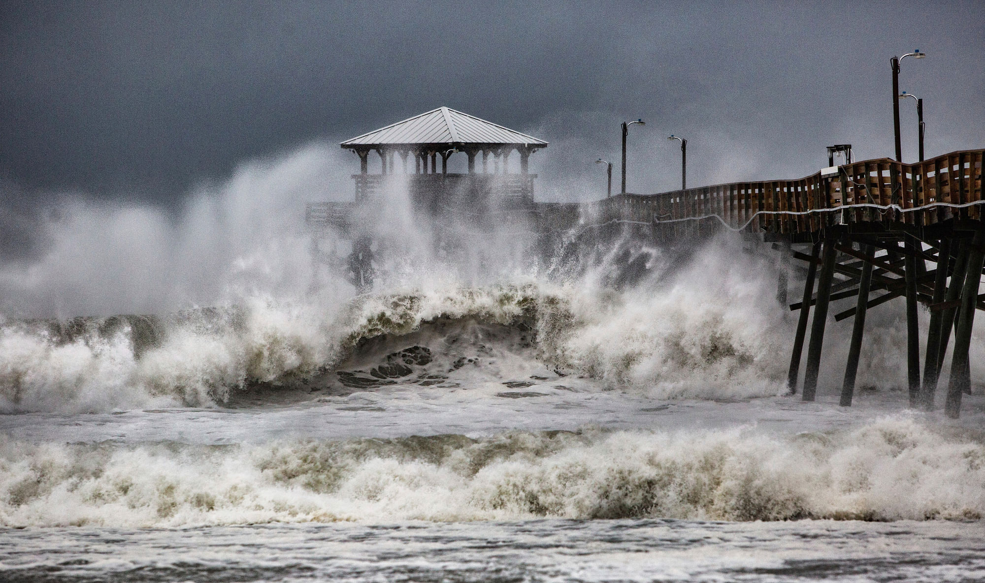 Waves slam the Oceana Pier &amp; Pier House Restaurant in Atlantic Beach, NC on Thursday, 13 September  2018 as Hurricane Florence approaches the area.
