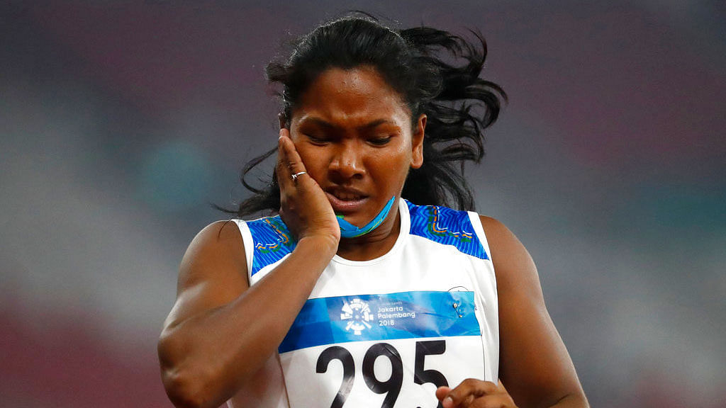 Swapna Barman reacts after her heptathlon 200m event at the Asian Games.