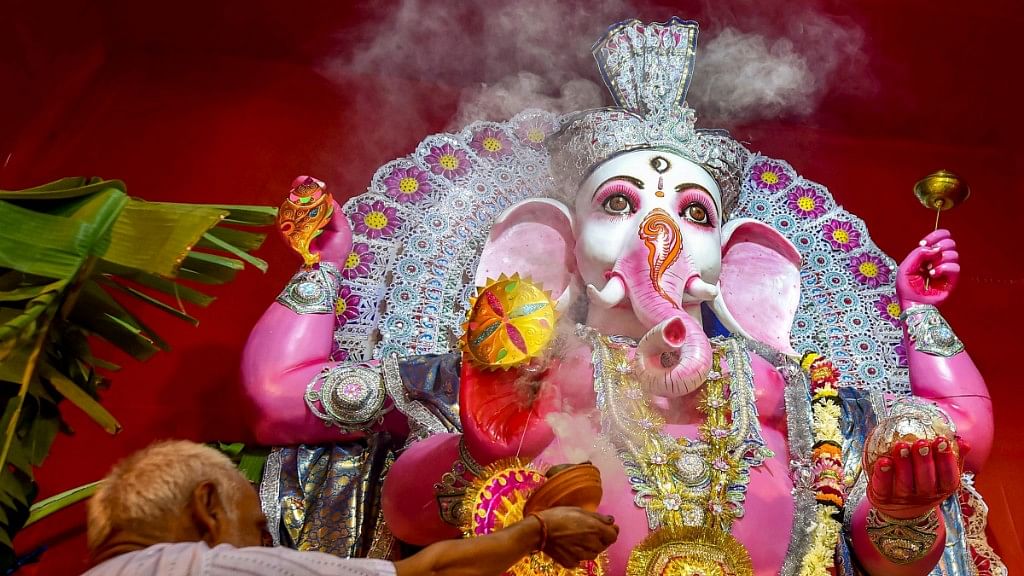  A priest offers prayers to Lord Ganesh on the occasion of Ganesh Chaturthi in Kolkata