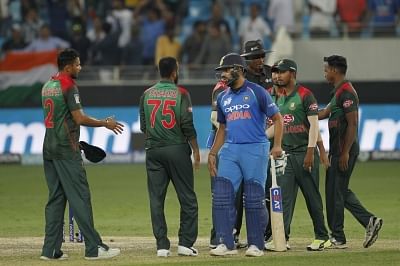 Dubai: Indian skipper Rohit Sharma shake hands with Bangladesh players after winning the First Match of Asia Cup Super Four stage against Bangladesh at Dubai International Cricket Stadium in Dubai, UAE on Sept 21, 2018. (Photo: Surjeet Yadav/IANS)
