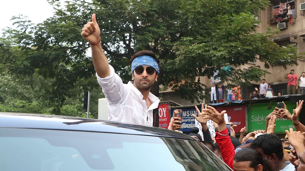 Ranbir Kapoor joins the crowds during the Ganpati visarjan procession.