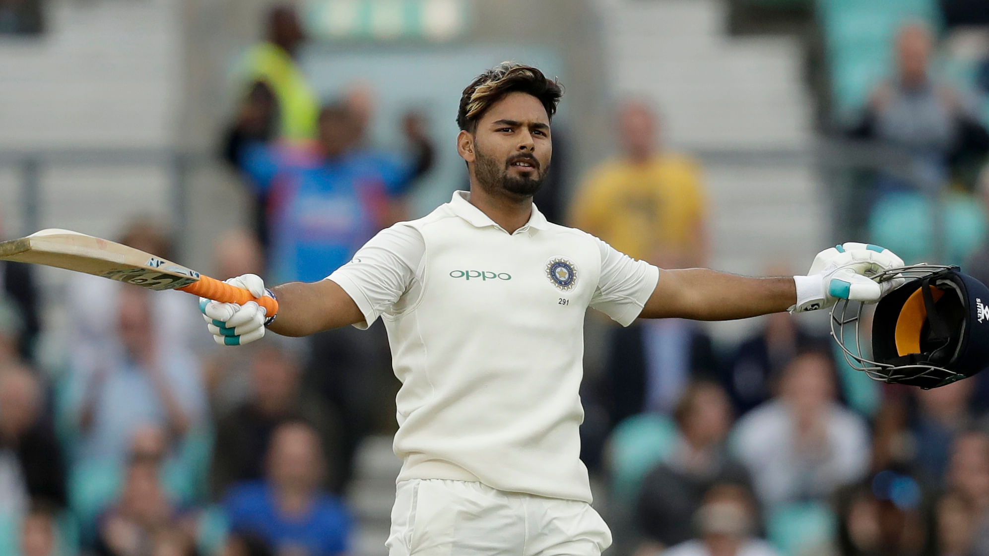 India wicketkeeper Rishabh Pant celebrates his century during the fifth cricket test match of a five match series between England and India at the Oval cricket ground.