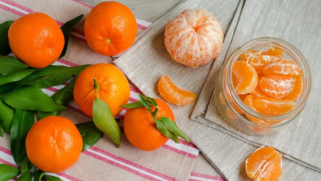 Have an orange. Great taste and makes your hair healthy.